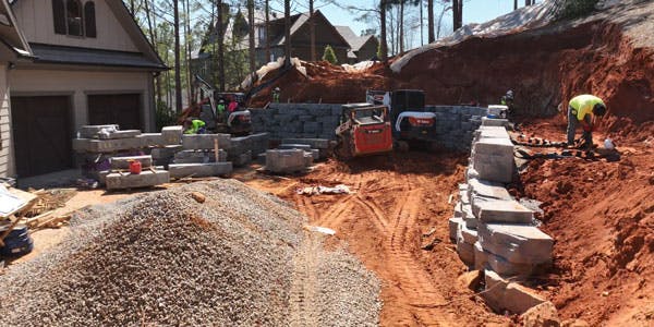 image of outcropping wall being installed next to house