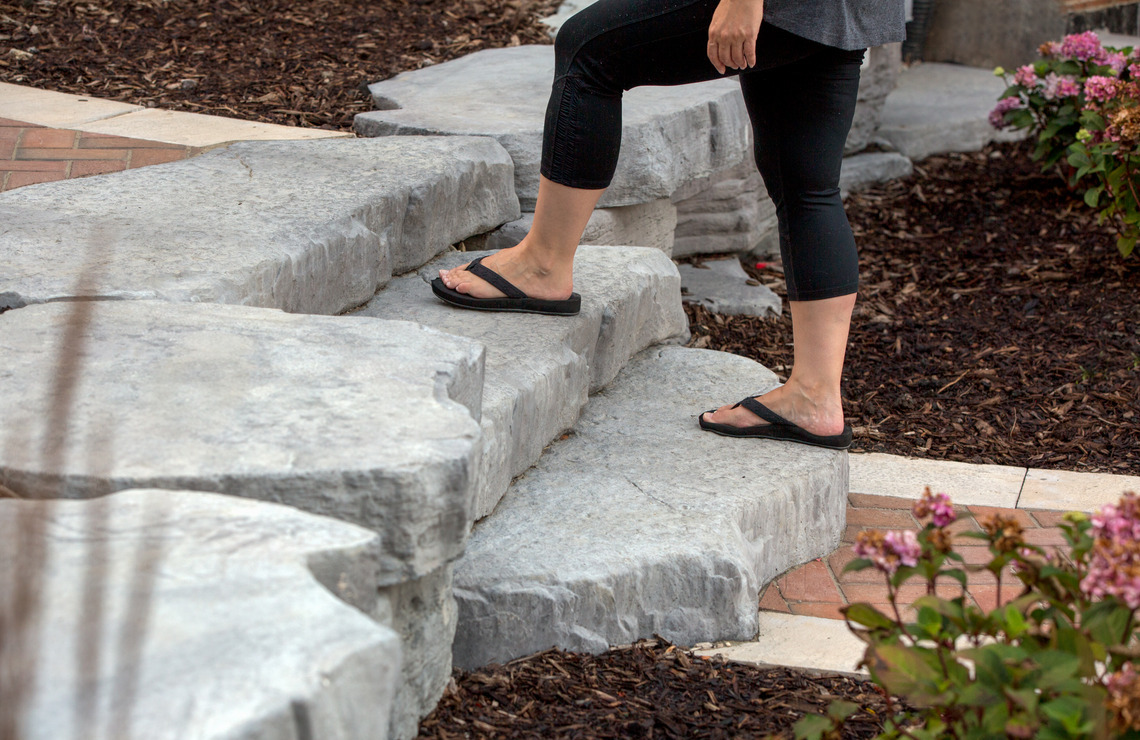 person walking on rosetta irregular steps