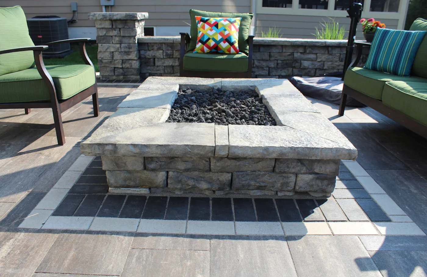 dimensional fire pit in patio area with chairs