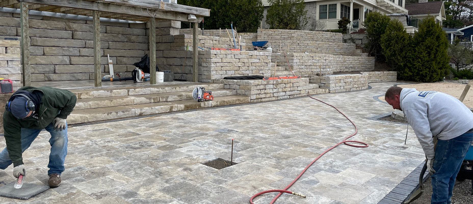 image of workers installing rosetta pavers