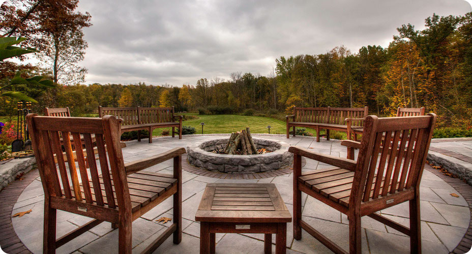 belvdere firepit on patio with chairs