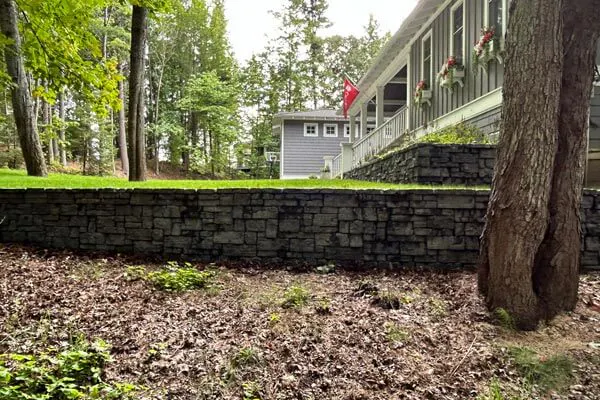 image of front yard of home with a retaining wall