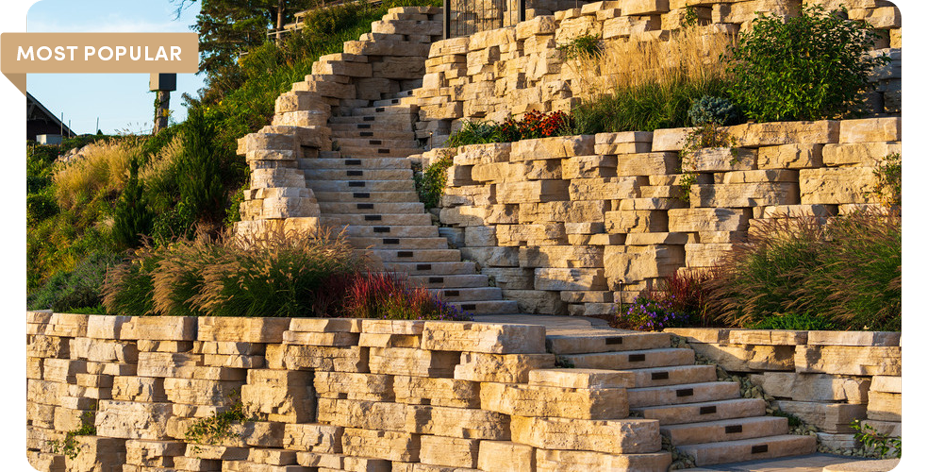 outcropping wall with plants and curving stairway