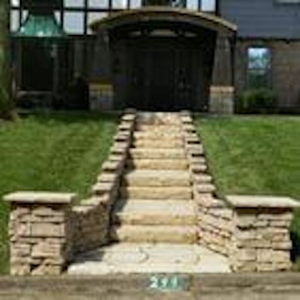 Stairway lined with Belvedere wall and Belvedere coping leading to front entrance