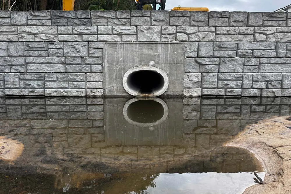 Redi-Rock wall installation with drain