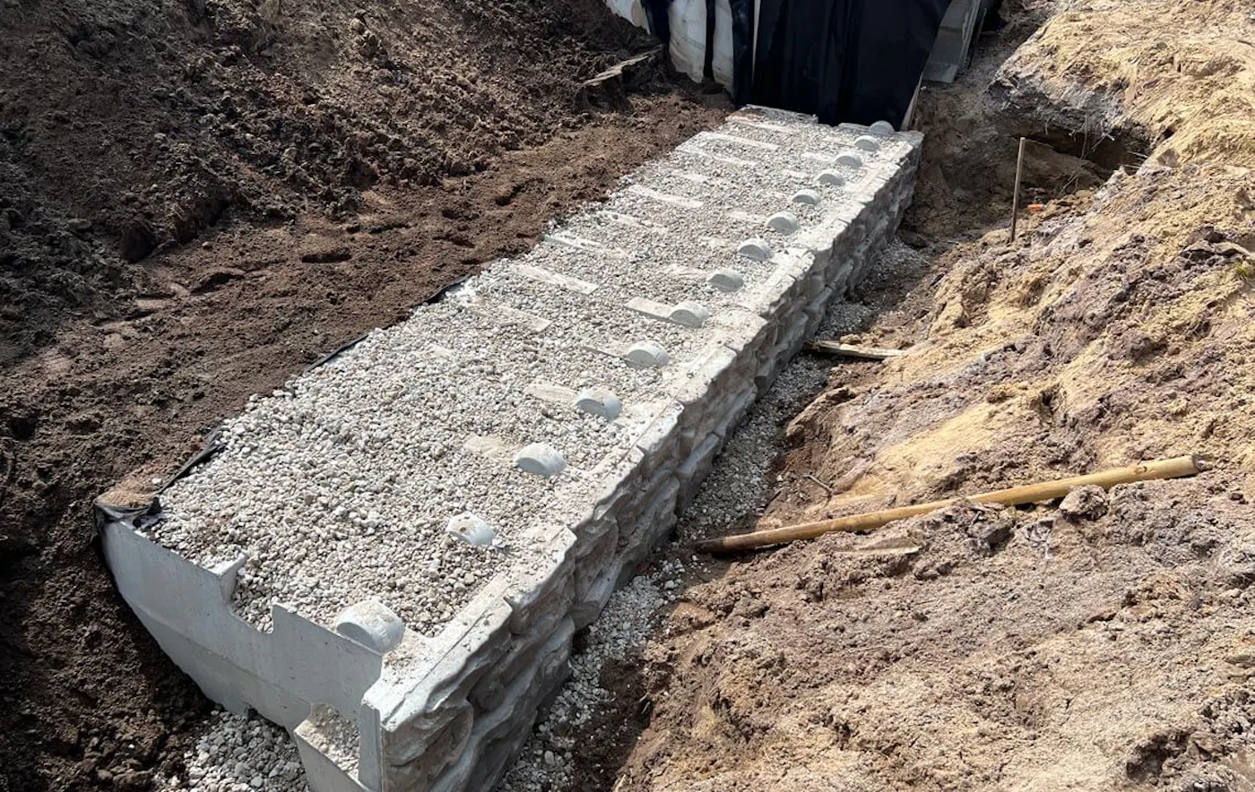 image of redi-rock xl blocks being infilled with gravel