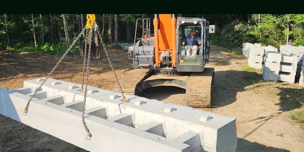 velpont block being carried by excavator crane